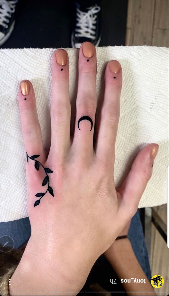 Black Moon And Leaf Hand Tattoo