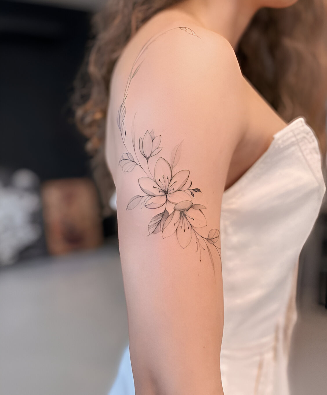 Delicate Flower Arm Tattoo