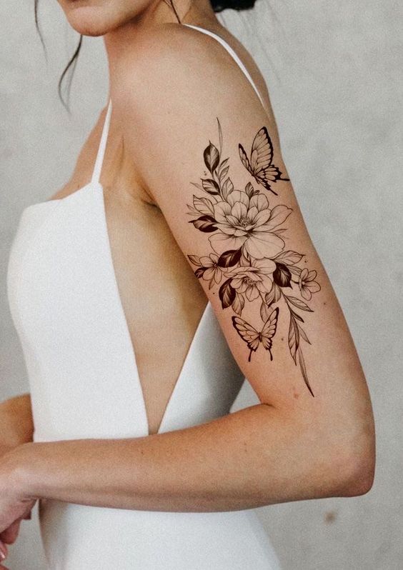 Flower And Butter Fly Feminine Arm Tattoo