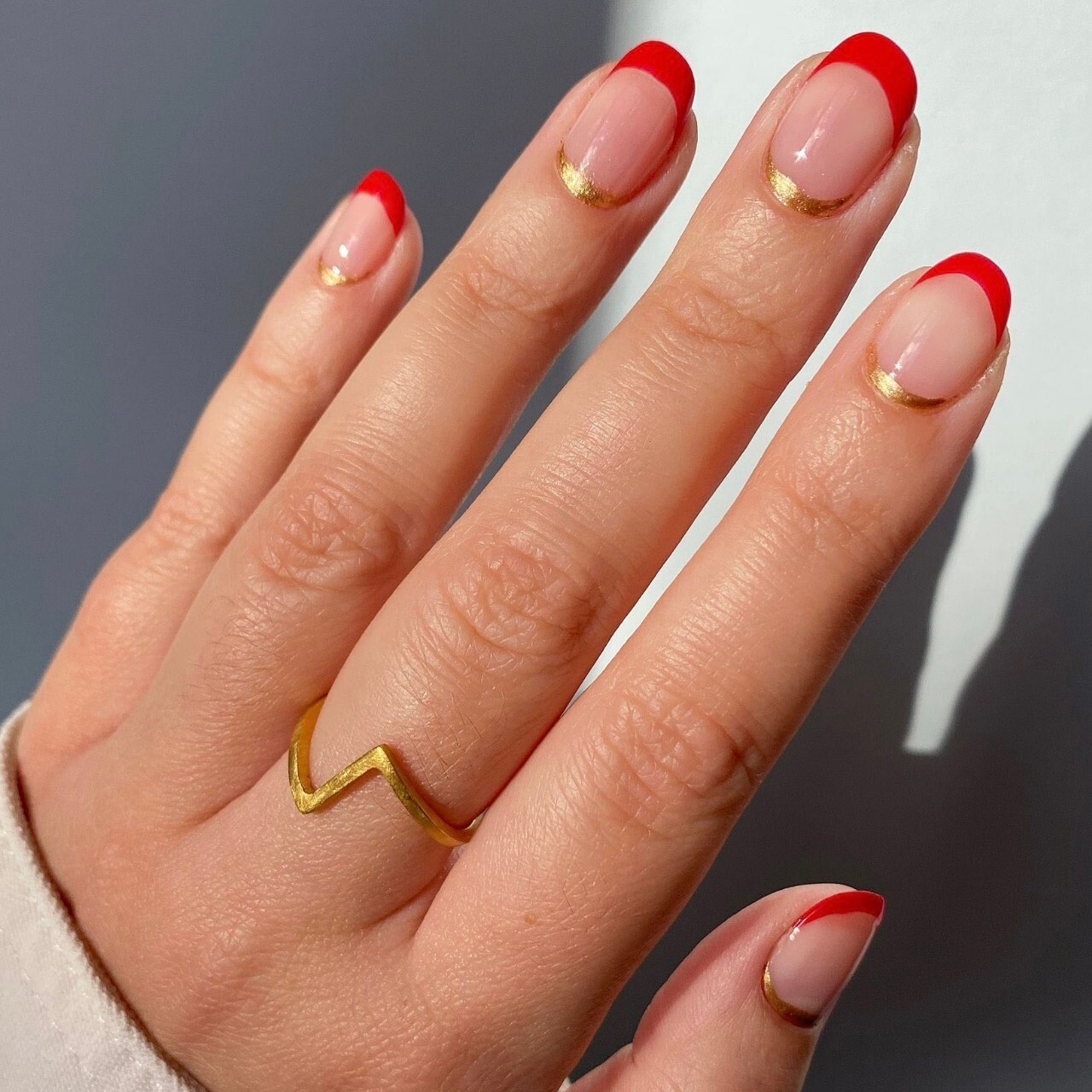 French Manicure With Red And Gold Halfmoon