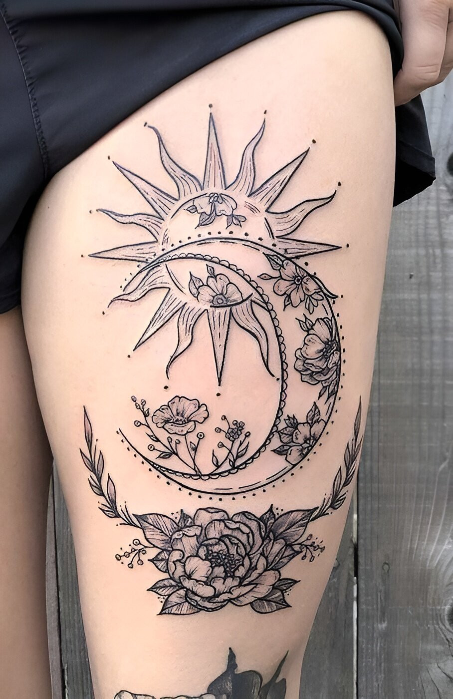 Impressive Sun And Moon Thigh Tattoo Design