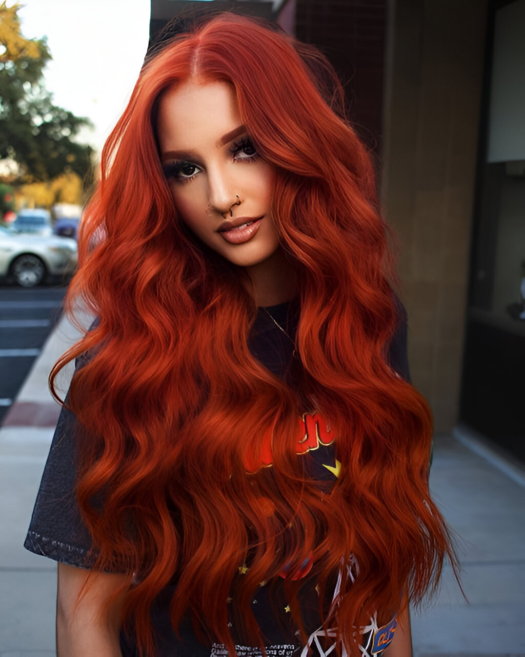 Long Voluminous Curls With Deep Red Orange Color