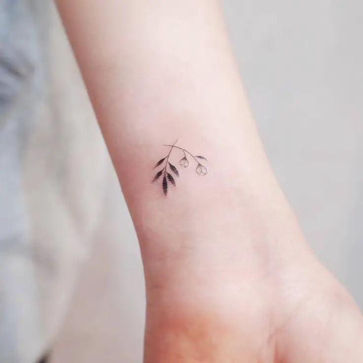 Small Wrist Tattoo With Leaf Design