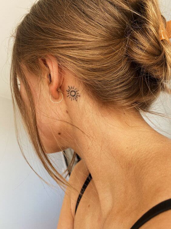 Behind-The-Ear Sun Tattoo