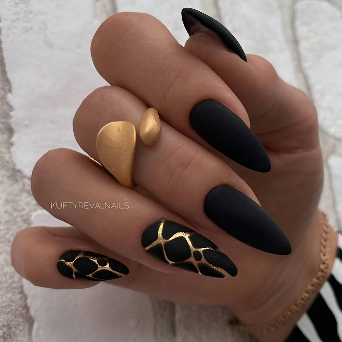 Black And Gold Lava Nails