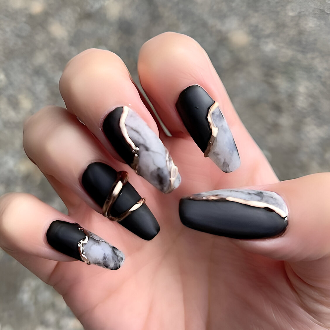 Black And Gold Marble Nail Design
