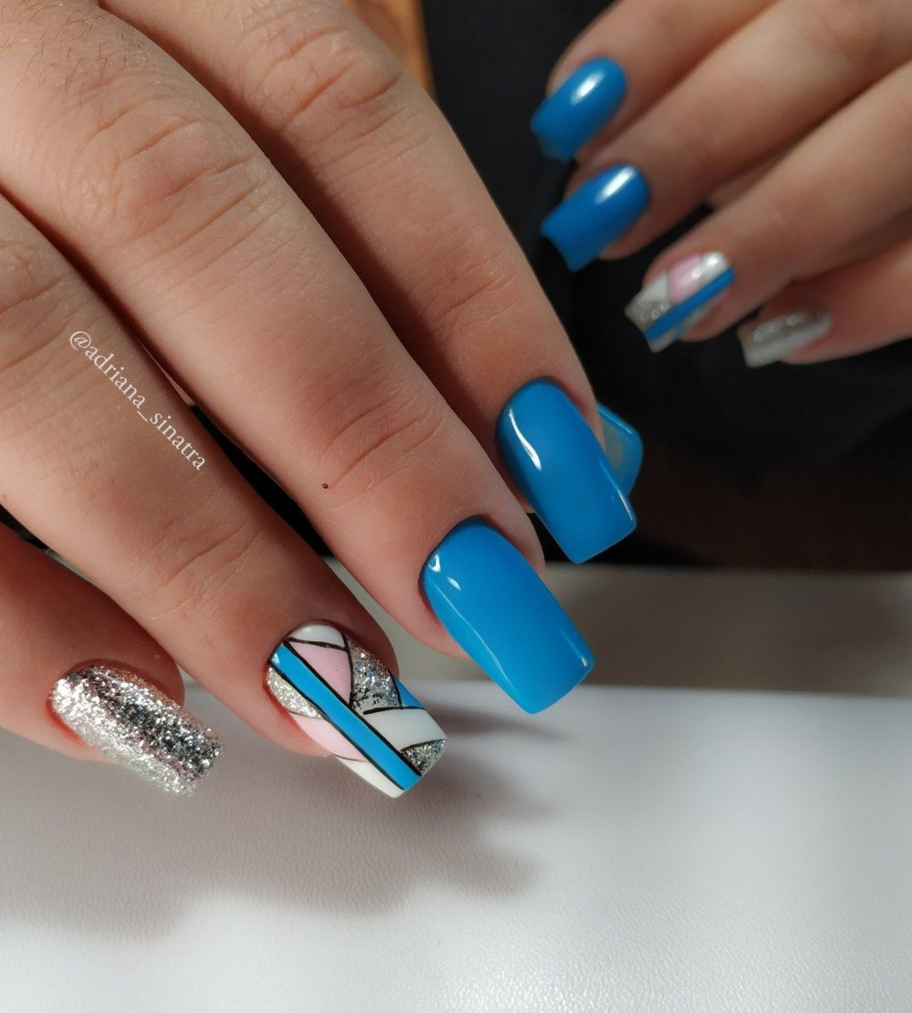Blue Acrylic Nails With Geometric Designs