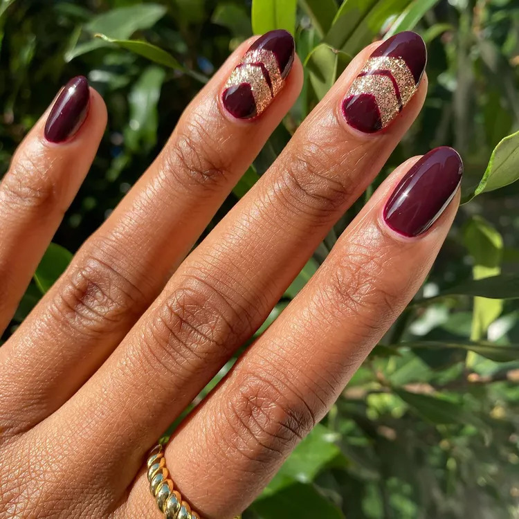Burgundy Manicure With Glitter Arrows