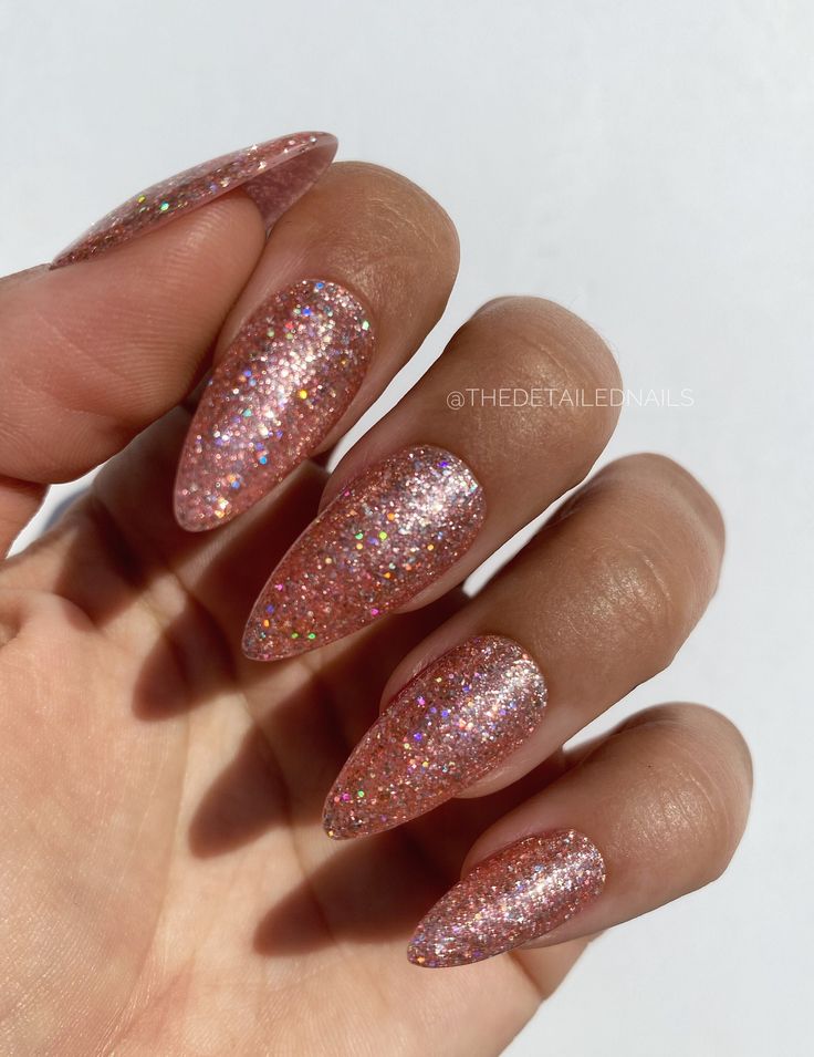 Glamorous Pink Glittered Almond Nails