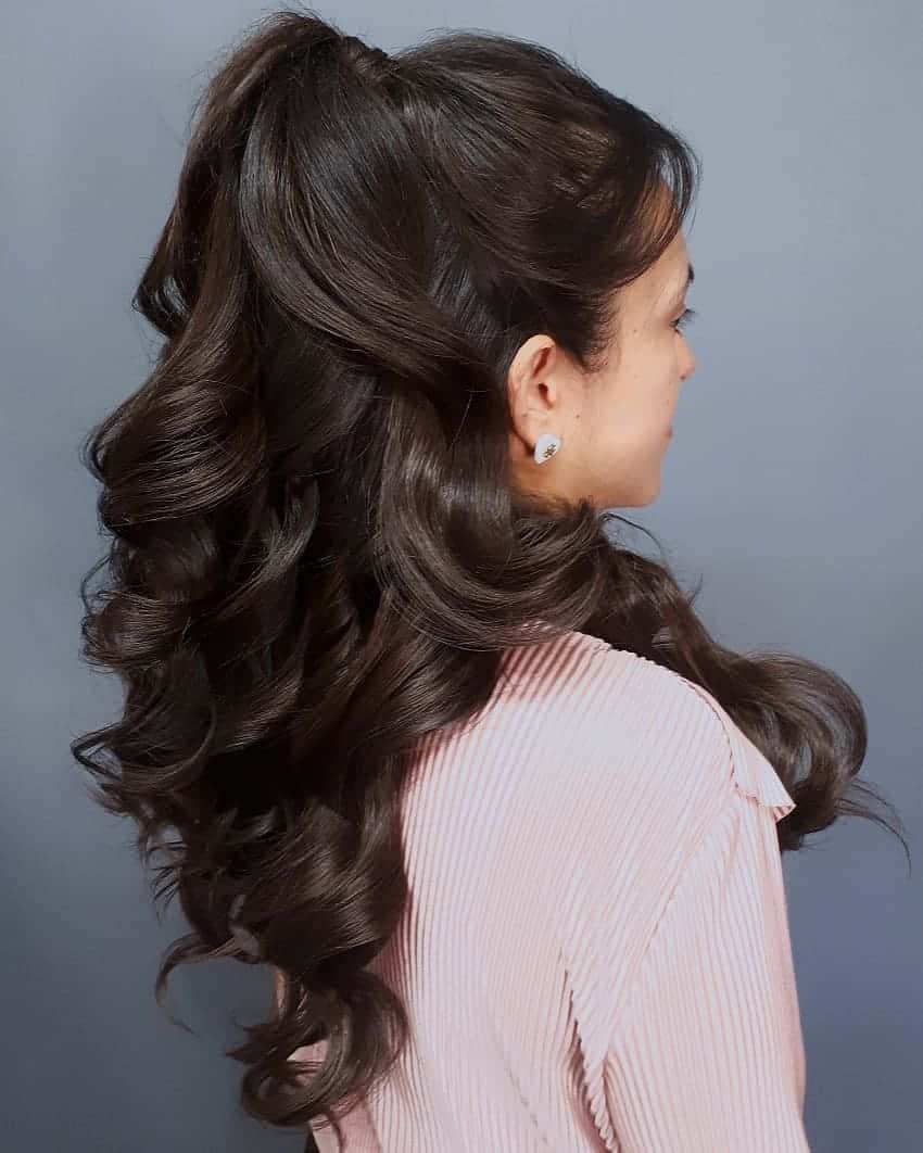 High Ponytail With Voluminous Curls