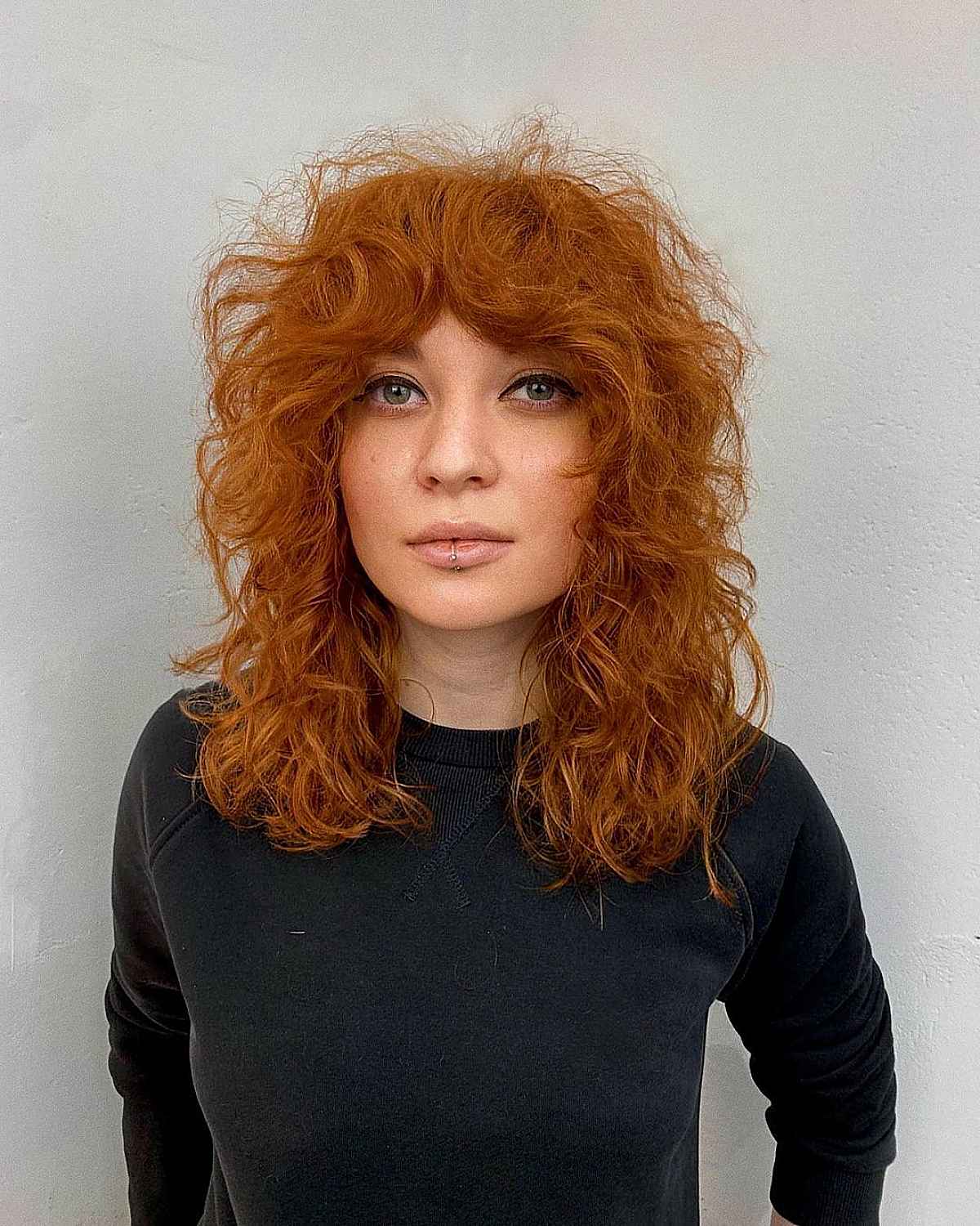 Layered Haircuts For Curly Hair With Curtain Bangs