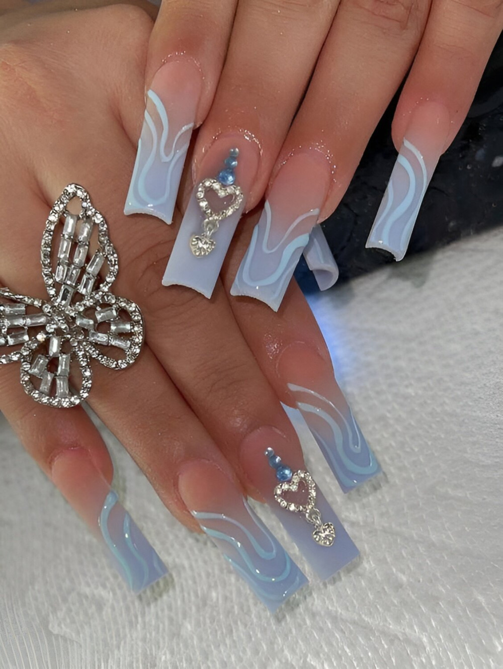 Pastel Blue Nails With Charms