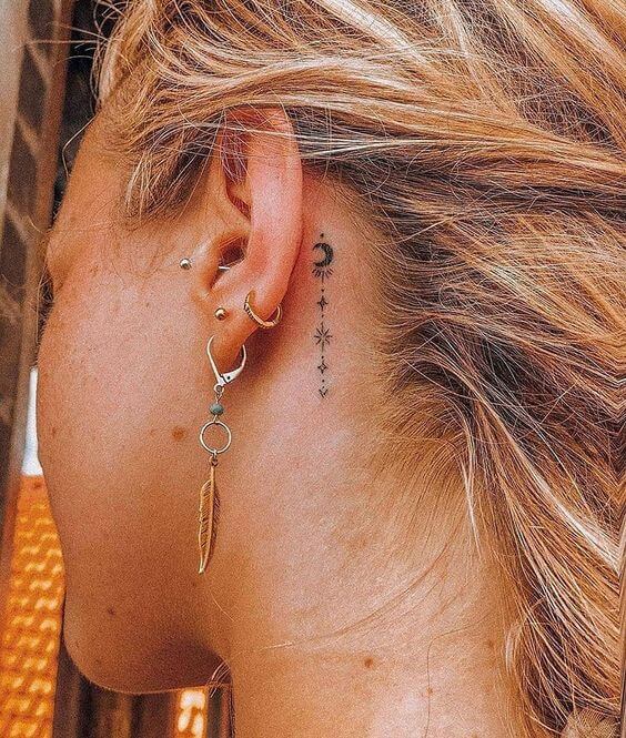 Vertical Moon And Star Behind-The-Ear Tattoos