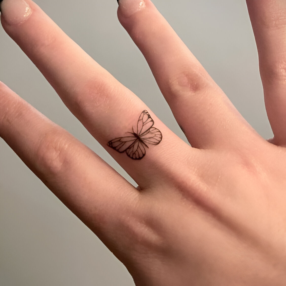 Butterfly Tattoos On Middle Finger