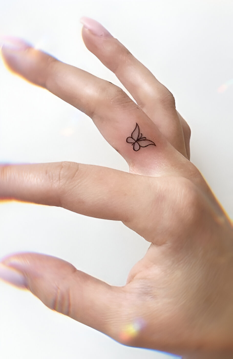 Mini Butterfly Finger Tattoo