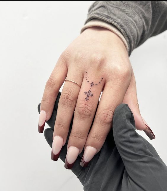 Rosary Finger Tattoos 3