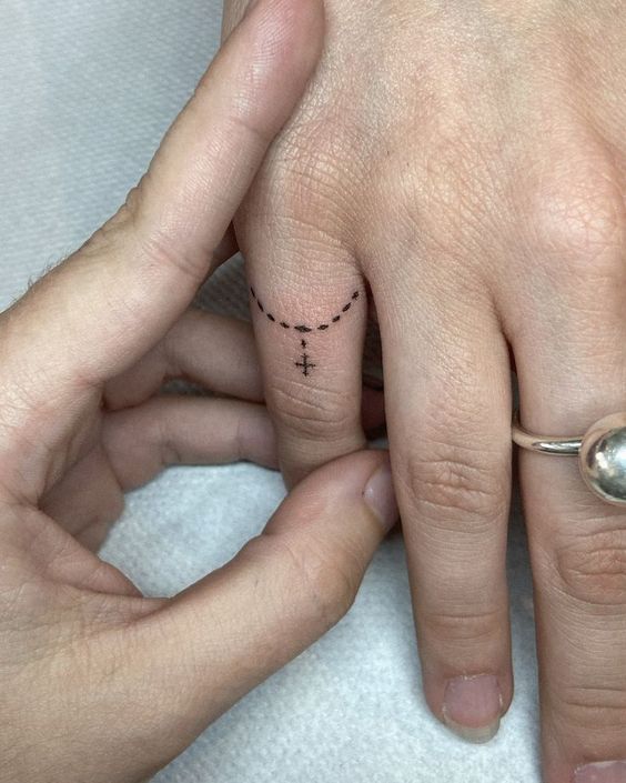 Rosary Finger Tattoos 6