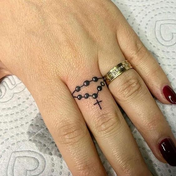 Rosary Finger Tattoos 8